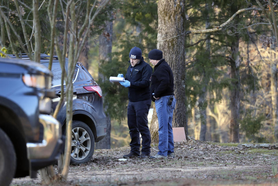 FILE - Law enforcement personnel investigate the scene of multiple shootings on Arkabutla Dam Road in Arkabutla, Miss on Friday, Feb. 17, 2023. Six people were fatally shot at multiple locations in a small town in rural Mississippi near the Tennessee state line. The U.S. is setting a record pace for mass killings in 2023, replaying the horror in a deadly loop roughly once a week so far this year. The bloodshed overall represents just a fraction of the deadly violence that occurs in the U.S. annually. (AP Photo/Nikki Boertman, File)