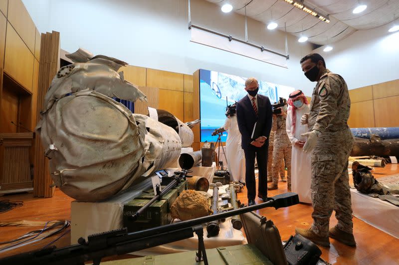 Saudi Arabia's Minister of State for Foreign Affairs Adel al-Jubeir and U.S. Special Representative for Iran Brian Hook look at the display of the debris of ballistic missiles and weapons, in Riyadh