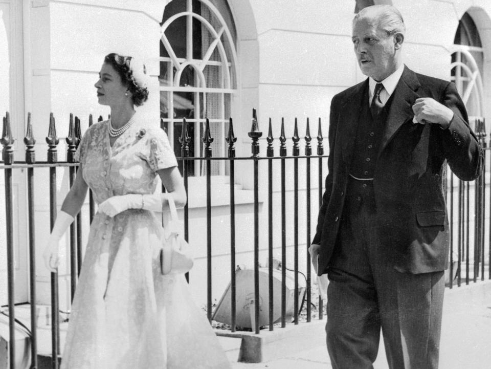 Queen Elizabeth and Harold Macmillan in 1954 walking in front of 10 Downing Street