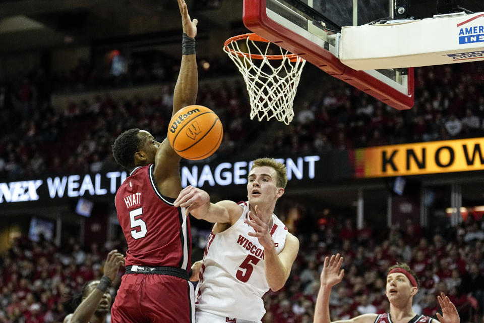 Wisconsin's Tyler Wahl (5) passes against Rutgers' Aundre Hyatt (5) during the second half of an NCAA college basketball game Saturday, Feb. 18, 2023, in Madison, Wis. (AP Photo/Andy Manis)