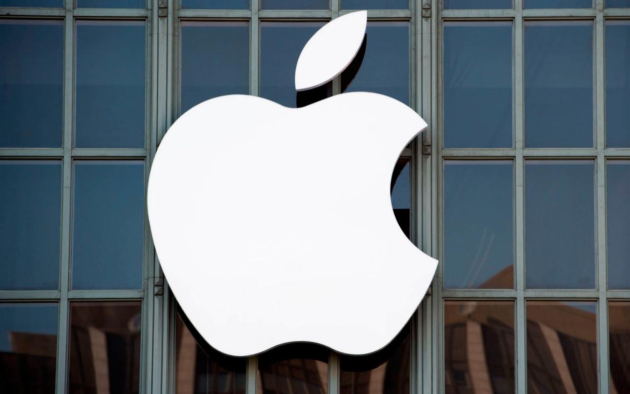 The Apple logo on the outside of Bill Graham Civic Auditorium in San Francisco, California - AFP