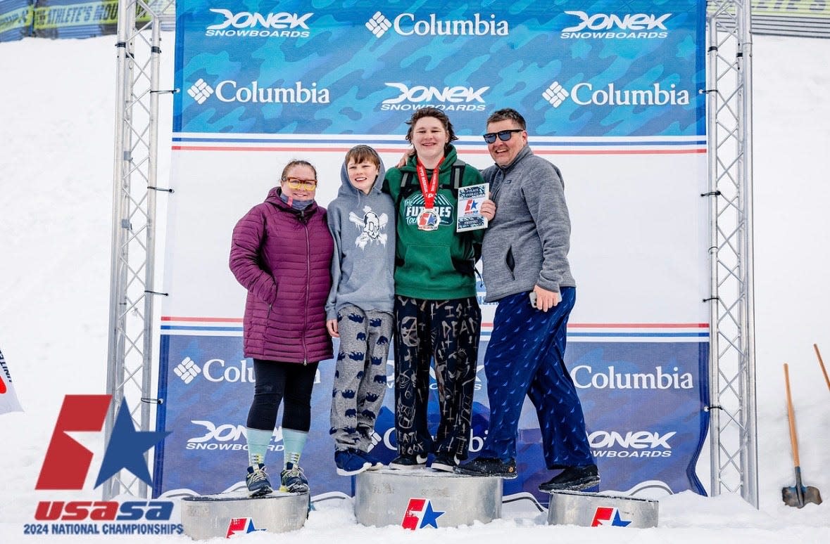 Milton's Leo Heikka is a nationally ranked freestyler skier. Here he is pictured with his mom Colleen, dad Jukka and younger brother Toby at a USASA national event.