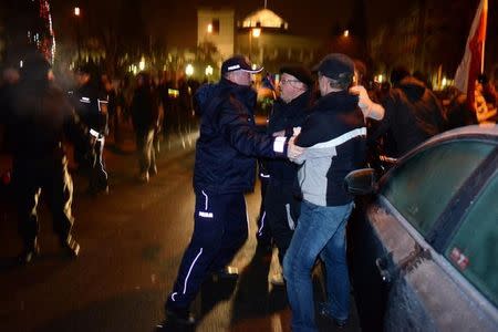 Protesters try to block the exit of the Polish Parliament in Warsaw December 17, 2016. Agencja Gazeta/Michal Jazwiecki/via Reuters