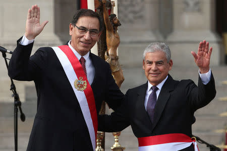 Peru's President Martin Vizcarra and new Prime Minister Cesar Villanueva wave during the swearing-in ceremony at the government palace in Lima, Peru April 2, 2018. REUTERS/Guadalupe Pardo