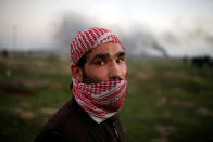<p>A Palestinian protester poses for a photograph at the scene of clashes with Israeli troops near the border with Israel, east of Gaza City, Jan. 12, 2018. “As a young man, I feel very oppressed and deprived of a dignified life so the only thing I can do is to revolt against the thing behind this suffering – the Israeli occupation. The occupation seized our homeland with the support of America which now recognises Jerusalem as Israel’s capital,” he said. (Photo: Mohammed Salem/Reuters) </p>