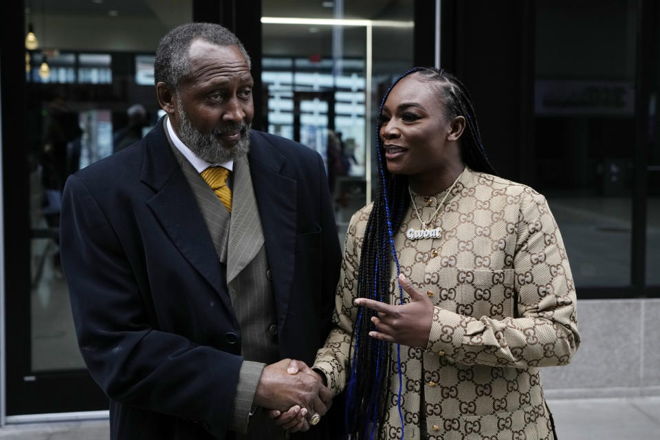 Two-time Olympic gold medalist and women's world middleweight champion Claressa Shields poses with Thomas "The Hitman" Hearns at Little Caesars Arena, Tuesday, April 18, 2023, in Detroit. Shields was on the verge of tears when seeing her name and image on the video boards at Little Caesars Arena, where she will fight Hanna Gabriels of Costa Rica on June 3. (AP Photo/Carlos Osorio)