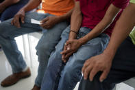 Mexican immigrants who have been unable to obtain work permits after living and working for years or even decades in the U.S., meet with activist Nora Sandigo and journalists, Tuesday, Nov. 7, 2023, in Miami. (AP Photo/Rebecca Blackwell)