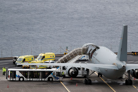 Ambulances transporting injured German tourists involved in a bus accident, arrive at a German Air Force medical airplane at Cristiano Ronaldo Airport in Funchal, on the island of Madeira, Portugal April 20, 2019. REUTERS/Rafael Marchante