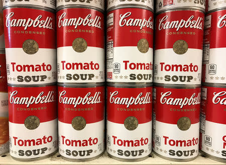 FILE PHOTO: Tins of Campbell's Tomato Soup are seen on a supermarket shelf in Seattle, Washington, U.S. February 10, 2017. REUTERS/Chris Helgren/File Photo