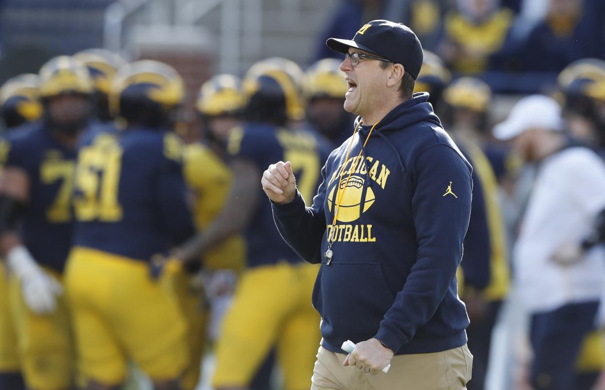 Michigan head coach Jim Harbaugh watches the team's annual spring NCAA college football game, Saturday, April 13, 2019, in Ann Arbor, Mich. (AP Photo/Carlos Osorio)