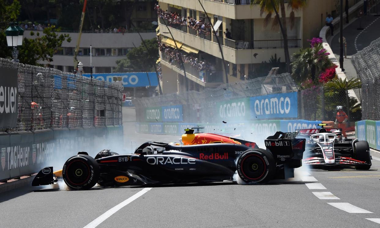 <span>Sergio Pérez’s Red Bull crashes after a huge accident involving Kevin Magnussen.</span><span>Photograph: Getty Images</span>