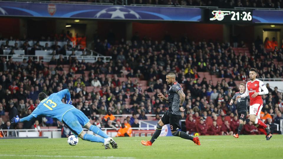 Bayern's Arturo Vidal scores his side's fifth goal past Arsenal goalkeeper David Ospina during the Champions League round of 16 second leg soccer match between Arsenal and Bayern Munich at the Emirates Stadium in London, Tuesday, March 7, 2017. (AP Photo/Frank Augstein)