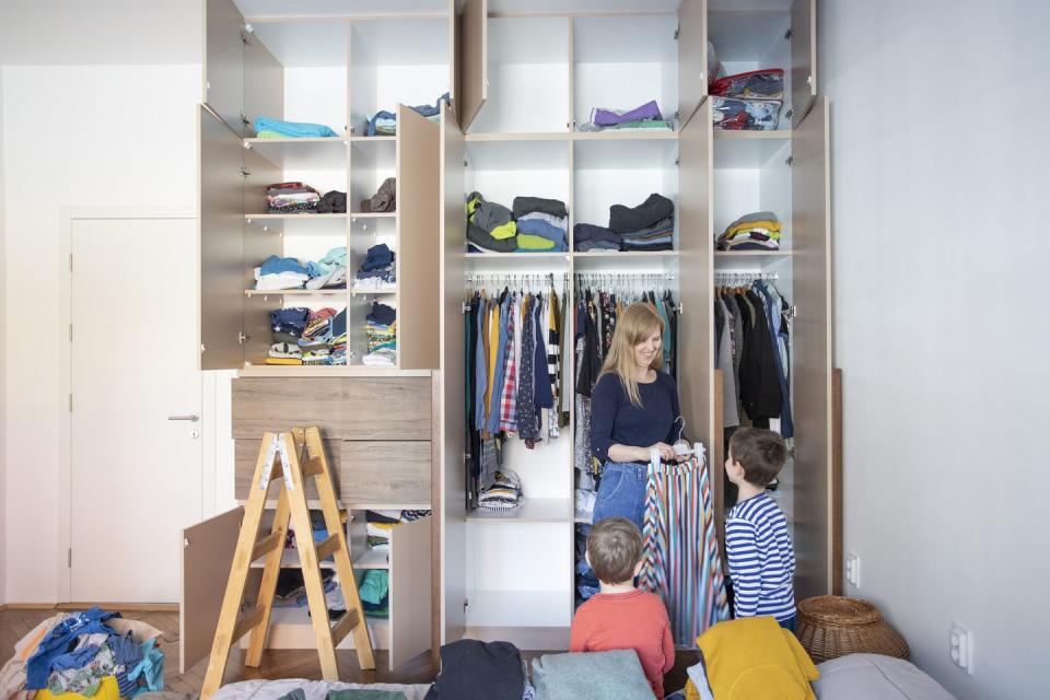 <p>Vertical storage systems are perfect for homeowners who have a lot of stuff but not enough space. “Start by locating studs with a stud finder, before deciding on shelf placement (mark with pencil),” says Marty Basher, home improvement expert with <a href="https://www.modularclosets.com/" rel="nofollow noopener" target="_blank" data-ylk="slk:Modular Closets.;elm:context_link;itc:0;sec:content-canvas" class="link ">Modular Closets.</a> “Attach brackets/cleats and slide the shelf plank on. As long as you have access to a drill and a stud finder, the process should take an hour or two at most.” You can purchase kits or make shelves yourself and follow DIY tutorials.<br></p><p>You can also add organization to your existing closet. Let’s say you’ve got a small closet that is laid out well, but you need additional storage space within it. For shelves, Basher recommends adding a few inexpensive shelf dividers to create more organized piles. Double the hanging space with an extender rod. A closet door is typically unused real estate, add hooks or hanging bars to the closet door. Under-shelf hanging baskets are perfect for smaller items like scarves, gloves, jewelry, or hand towels and wash cloths.</p>