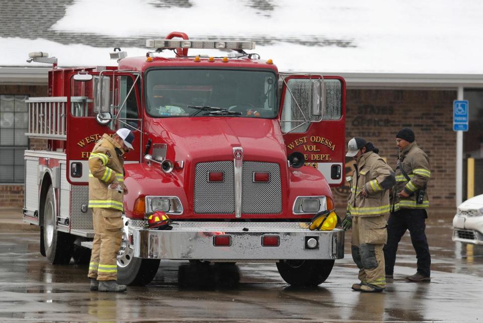 Members of the West Odessa Volunteer Fire Department ready their equipment in Fritch, Tx. Residents have been working to recover from the Tuesday grass fires that devastated parts of the panhandle.