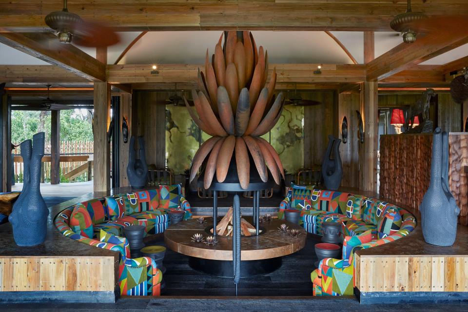 A copper lily, Xigera Safari Lodge's emblem, tops the fireplace in the lounge.