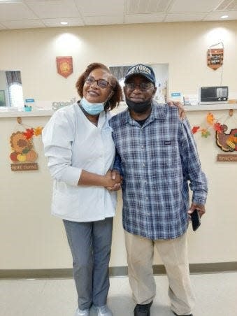 Dr. Valerie Washington of Affordable Dentures & Implants located (left) provided free dental care as a special thank you to Air Force veteran Gilbert Haynes, 70, for his Military service. The dental care included a tooth extraction and new upper and lower dentures to restore Gilbert’s smile.