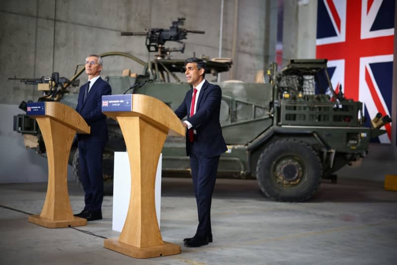 NATO Secretary General Jens Stoltenberg (L) and UK Prime Minister Rishi Sunak attend a joint press conference at the Warsaw Armoured Brigade in Warsaw during Sunak's visit to Poland. Henry Nicholls/PA Wire/dpa