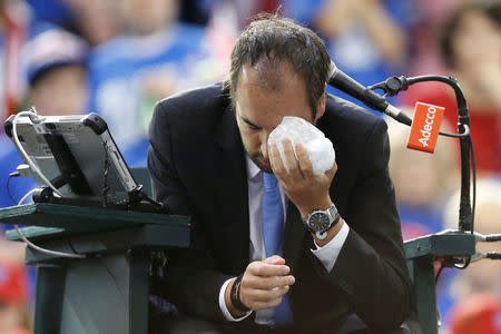 Tennis - Canada v Britain - Davis Cup World Group First Round - Ottawa, Ontario, Canada - 5/2/17. Umpire Arnaud Gabas holds an ice pack to his eye after being struck by a ball during a singles match between Canada's Denis Shapovalov and Britain's Kyle Edmund. REUTERS/Chris Wattie