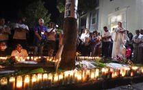 Father David Scotchie leads prayers and songs during a vigil for missing 19-year-old Valencia College student Miya Marcano at Arden Villas, Friday, Oct. 1, 2021, in Orlando, Fla. Orange County Sheriff John Mina said Saturday that authorities found Marcano’s body near an apartment building. Marcano vanished on the same day a maintenance man improperly used a master key to enter her apartment. (Chasity Maynard/Orlando Sentinel via AP)