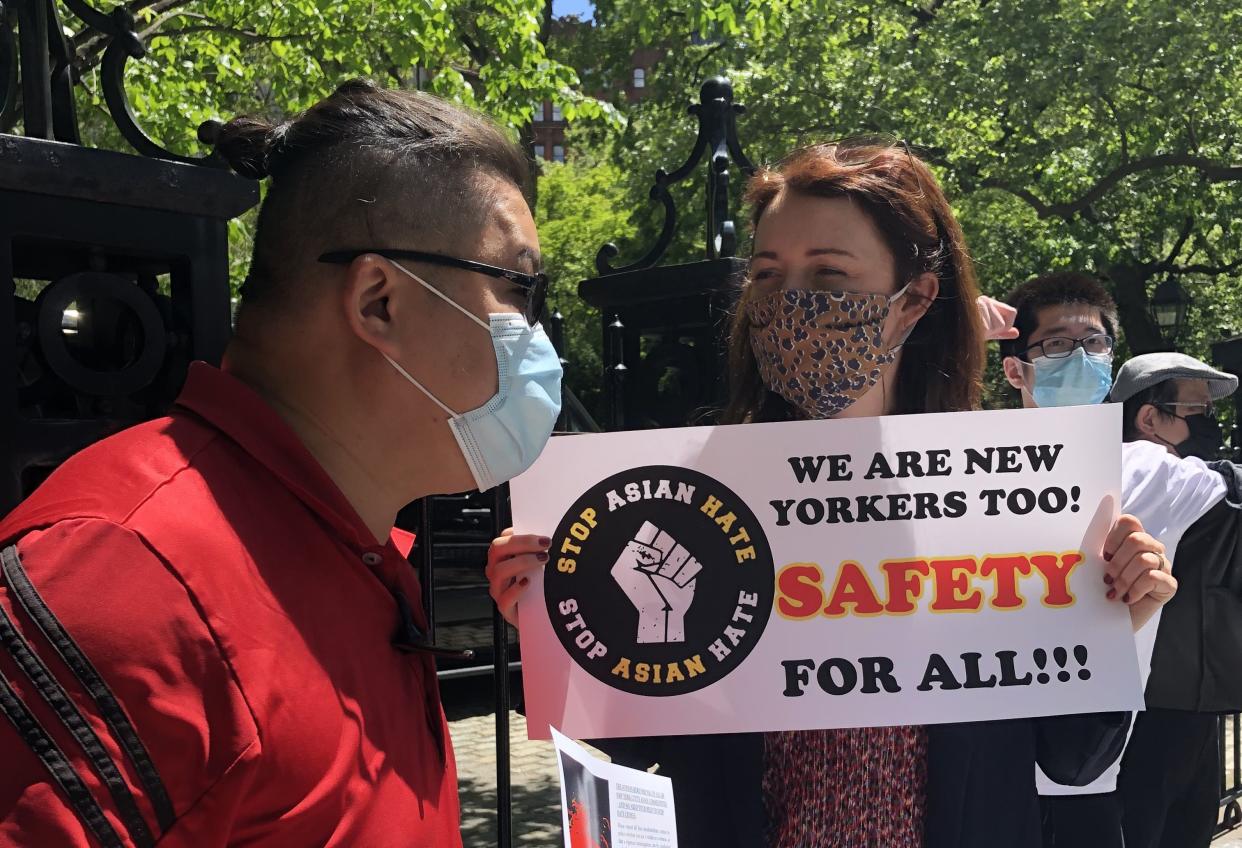 Manhattan borough president candidate Lindsey Boylan speaks with Jerry Chan of Brooklyn at a rally against anti-Asian hate outside City Hall on May 13, 2021.