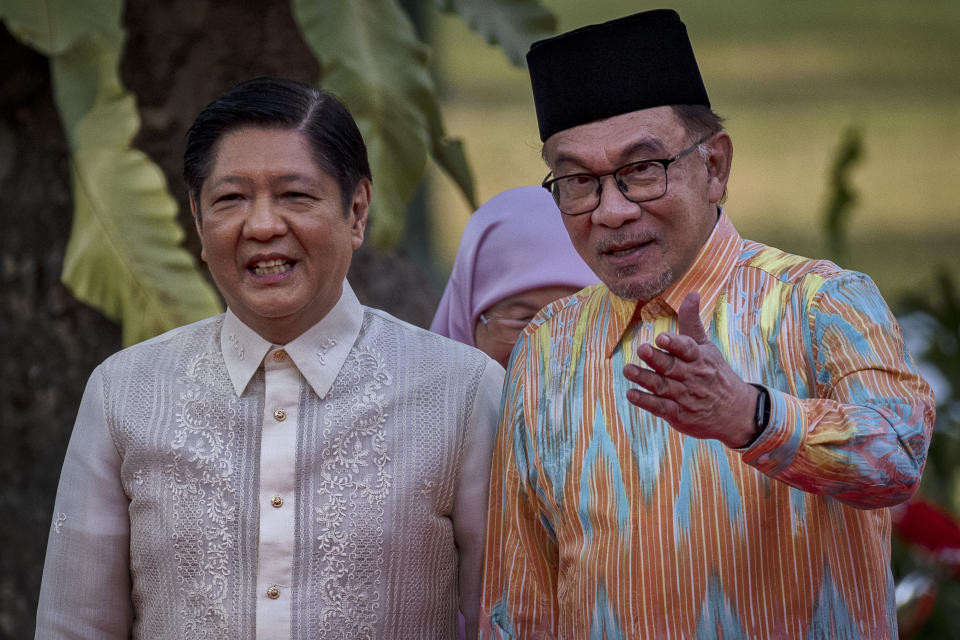 Malaysian Prime Minister Anwar Ibrahim, right, talks with Philippine President Ferdinand Marcos Jr. during a welcome ceremony at Malacanang Palace on Wednesday, March 1, 2023 in Manila, Philippines. (Ezra Acayan/Pool Photo via AP)