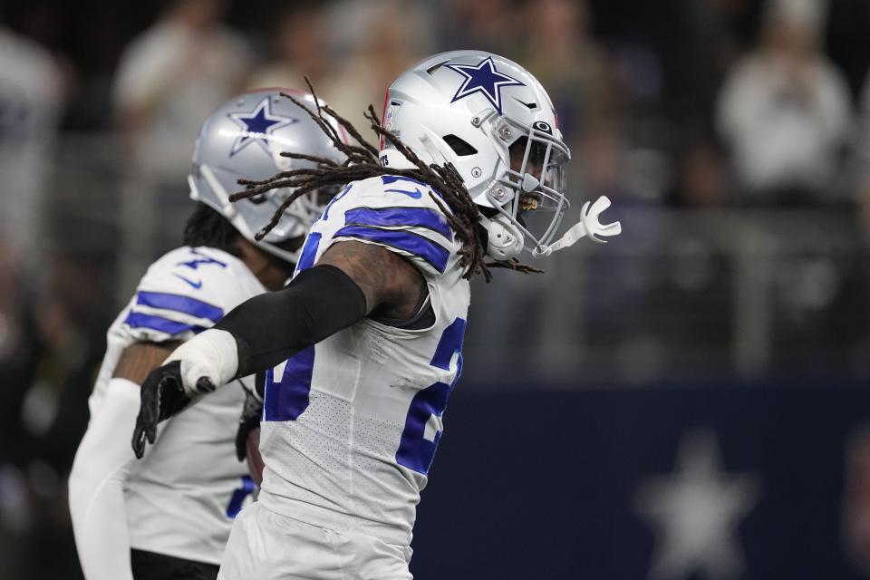 Dallas Cowboys' Malik Hooker (28) celebrates during the second half of an NFL football game against the Indianapolis Colts, Sunday, Dec. 4, 2022, in Arlington, Texas. (AP Photo/Tony Gutierrez)