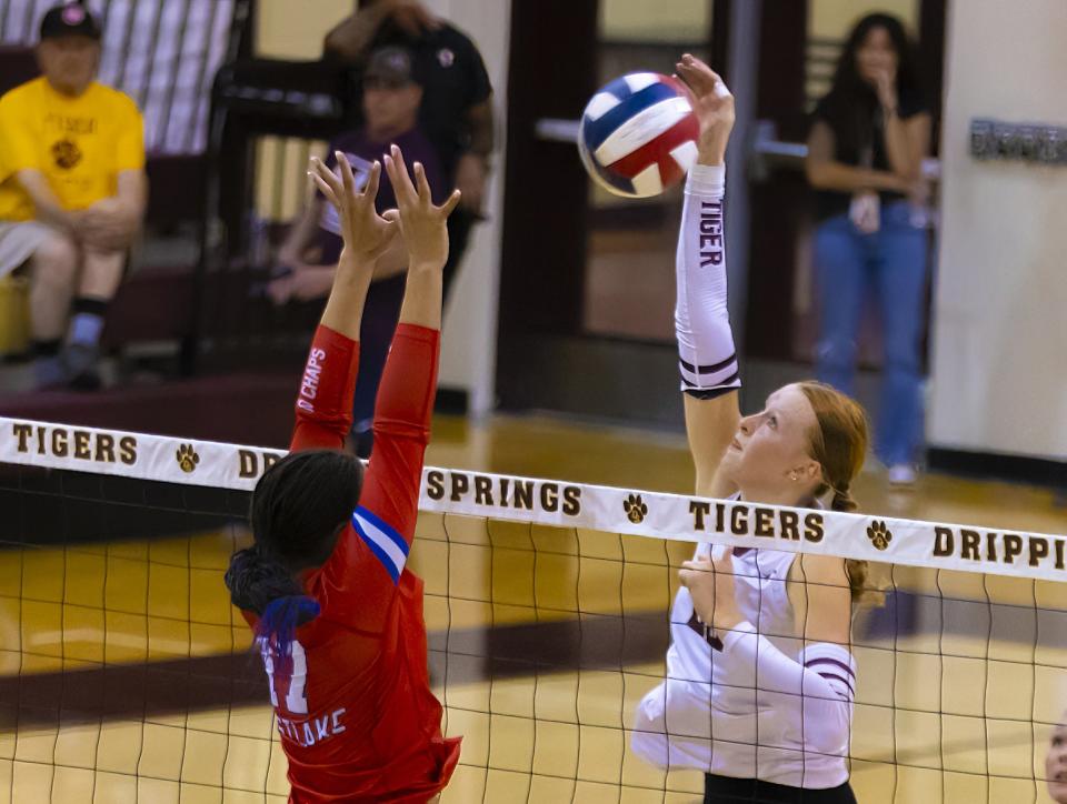 Dripping Springs' Henley Anderson, right, whips a shot past Westlake outside hitter Stephanie Collins during their District 26-6A match in September. Anderson, the two-time Central Texas player of the year, has earned a spot on the U.S. U-19 national team.