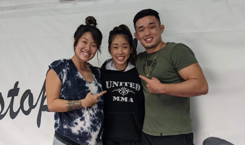 MMA fighter Victoria Lee (centre) with her siblings Angela (left) and Christian, both of whom are MMA world champions. (PHOTO: ONE Championship)