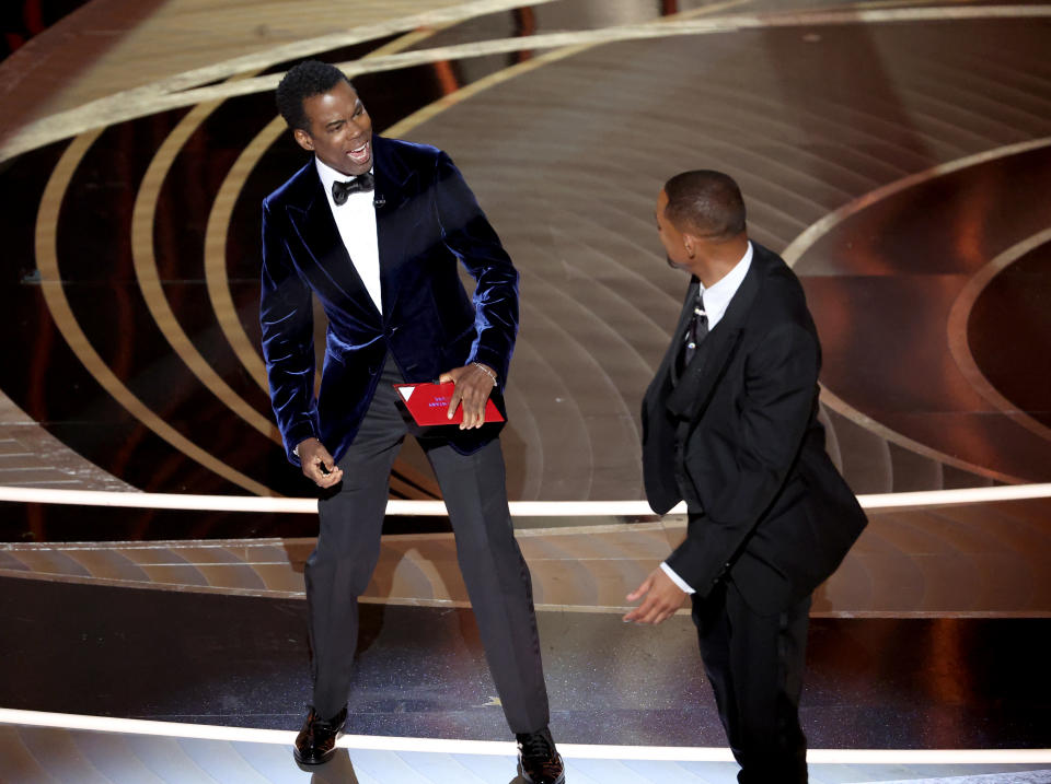 HOLLYWOOD, CA - March 27, 2022.    Chris Rock and Will Smith onstage during the show  at the 94th Academy Awards at the Dolby Theatre at Ovation Hollywood on Sunday, March 27, 2022.  (Myung Chun / Los Angeles Times via Getty Images)