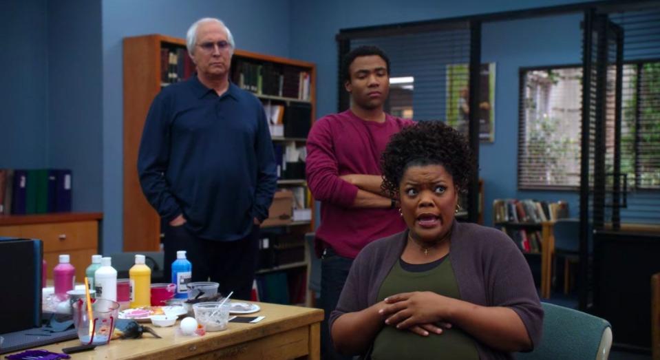 Shirley talking with Troy and Pierce standing behind her in "Community"