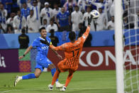 Saudi Arabia's Al Hilal' Salem Al Dawsari, left, shoots the ball at UAE's Al Ain' goalkeeper Khalid Eisa during the second leg of their AFC Champions League 2023/24 semi-final match at Kingdom Arena Stadium in Riyadh, Saudi Arabia,Tuesday, April 23, 2024. (AP Photo)