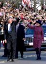 President Bill Clinton waves to the crowd as he and Hillary walk north on 15th St NW outside the US Treasury building, January 20, 1993 after he became the 42nd President of the United States. REUTERS