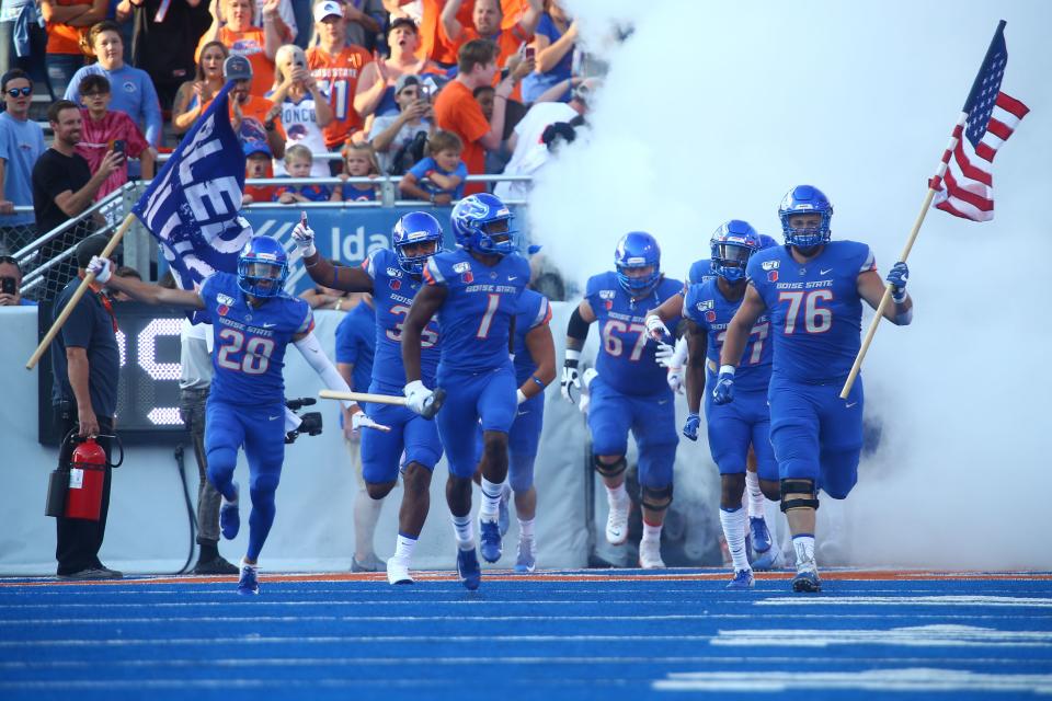 Boise State Broncos players take the field before the first half against the Marshall Thundering Herd at Albertsons Stadium in 2019.