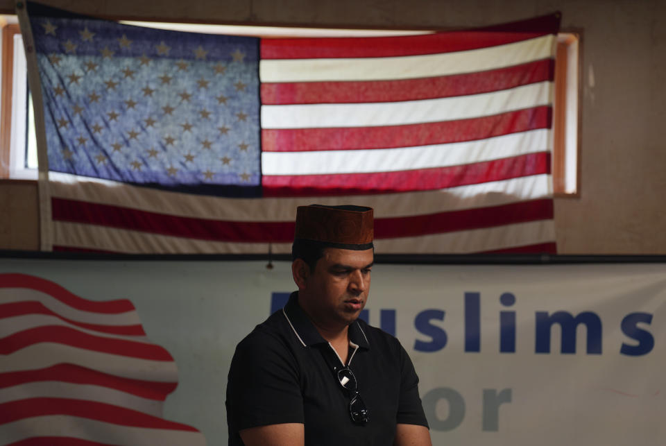 A member of the Zion Ahmadiyya Muslim community attends Friday prayer in Zion, Ill., on Friday, Sept. 16, 2022. A century after the Ahmadis' prophet, Mirza Ghulam Ahmad, challenged Zion's founder, John Alexander Dowie, a Christian faith healer, to a prayer duel, the community has built their first official mosque in the city. (AP Photo/Jessie Wardarski)