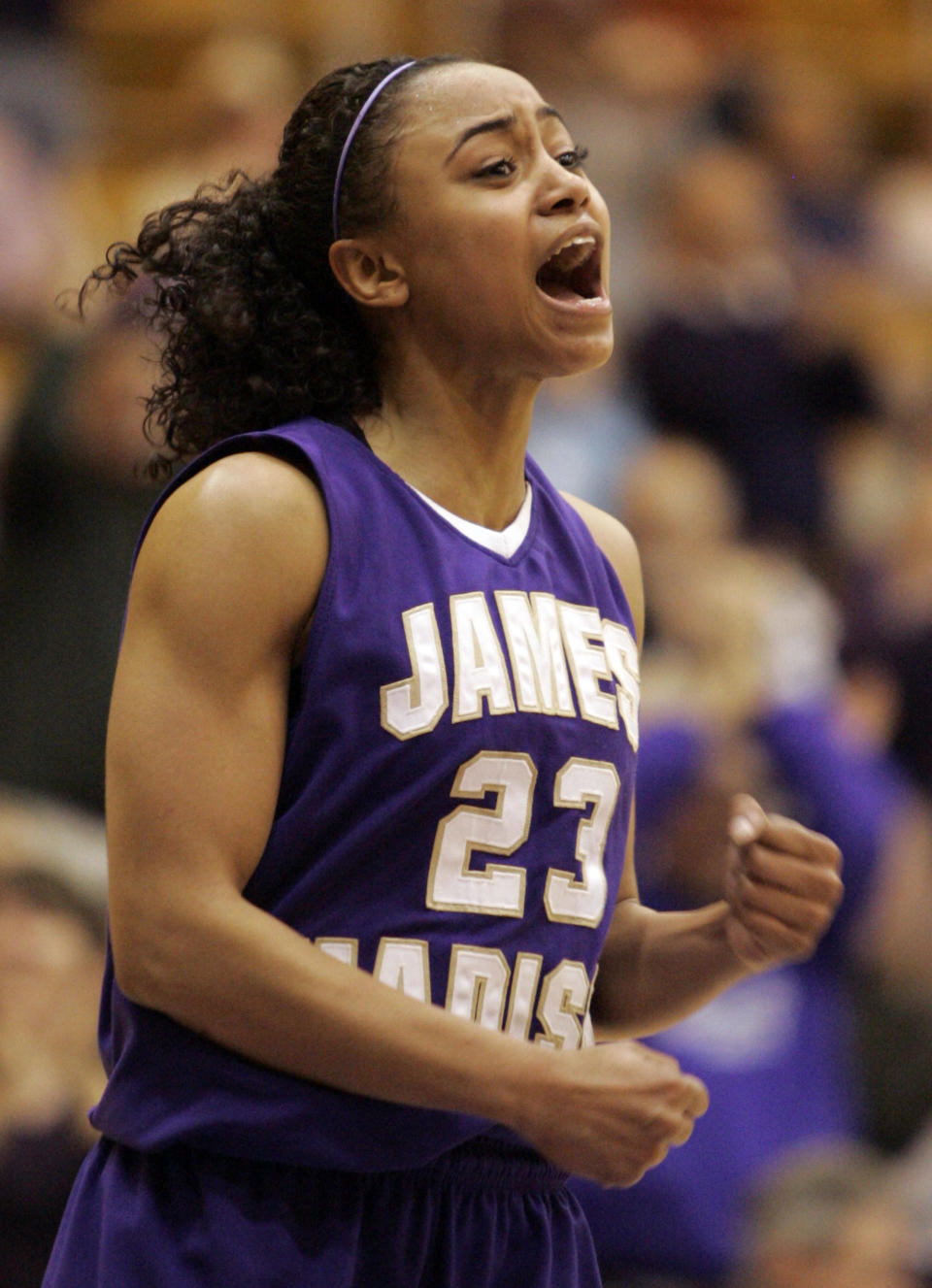 FILE - In this March 14, 2009, file photo, James Madison guard Dawn Evans rallies her team during second half of an NCAA college basketball game in Harrisonburg, Va. Evans, one of the nation's leading scorers for three years as a point guard at James Madison, has left her professional team in France and returned to Tennessee to prepare for a kidney transplant. (AP Photo/Steve Helber, File)