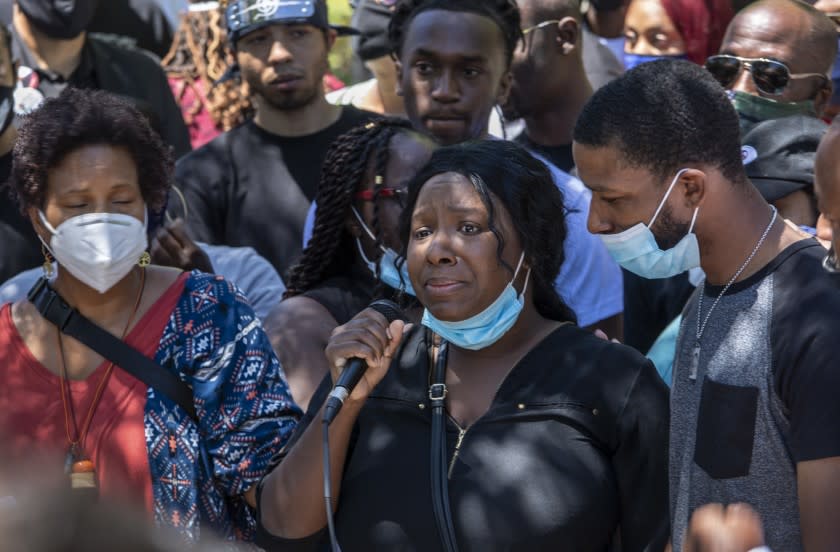 PALMDALE, CA - JUNE 13: Diamond Alexander, center, sister of Robert Fuller, pleads for justice for her brother as hundreds of gathered in Palmdale on Saturday to mourn the death of Fuller on Saturday, June 13, 2020 in Palmdale, CA. (Brian van der Brug / Los Angeles Times)