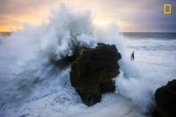 <p>Andrey Karr from Western Riders Slacklines at sunset above big waves in Nazare, Portugal, Dec. 27, 2017. (© Aidan Williams/National Geographic Travel Photographer of the Year Contest) </p>