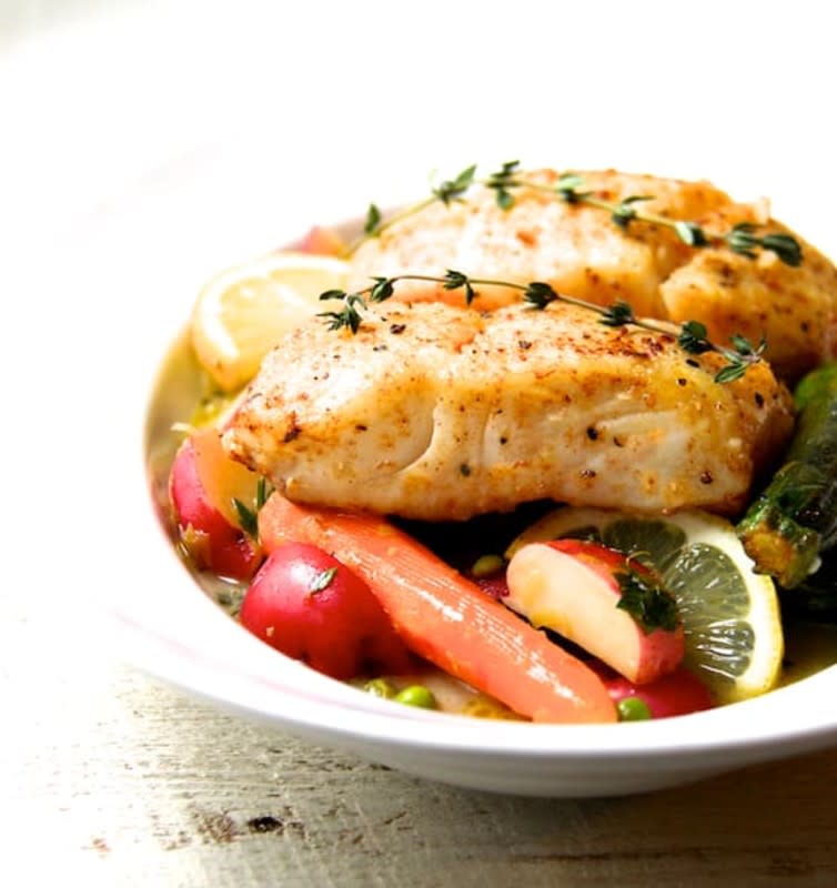 <p>From A Chef's Kitchen</p><p>Tender white fish like halibut and perky vegetables cooked in lemon juice make for a perfect dinner for two!</p><p><strong>Get the recipe: <a href="https://www.fromachefskitchen.com/butter-basted-halibut-with-lemon-braised-baby-vegetables/" rel="nofollow noopener" target="_blank" data-ylk="slk:Butter-Basted Halibut with Lemon-Braised Baby Vegetables;elm:context_link;itc:0;sec:content-canvas" class="link rapid-noclick-resp">Butter-Basted Halibut with Lemon-Braised Baby Vegetables</a></strong></p>