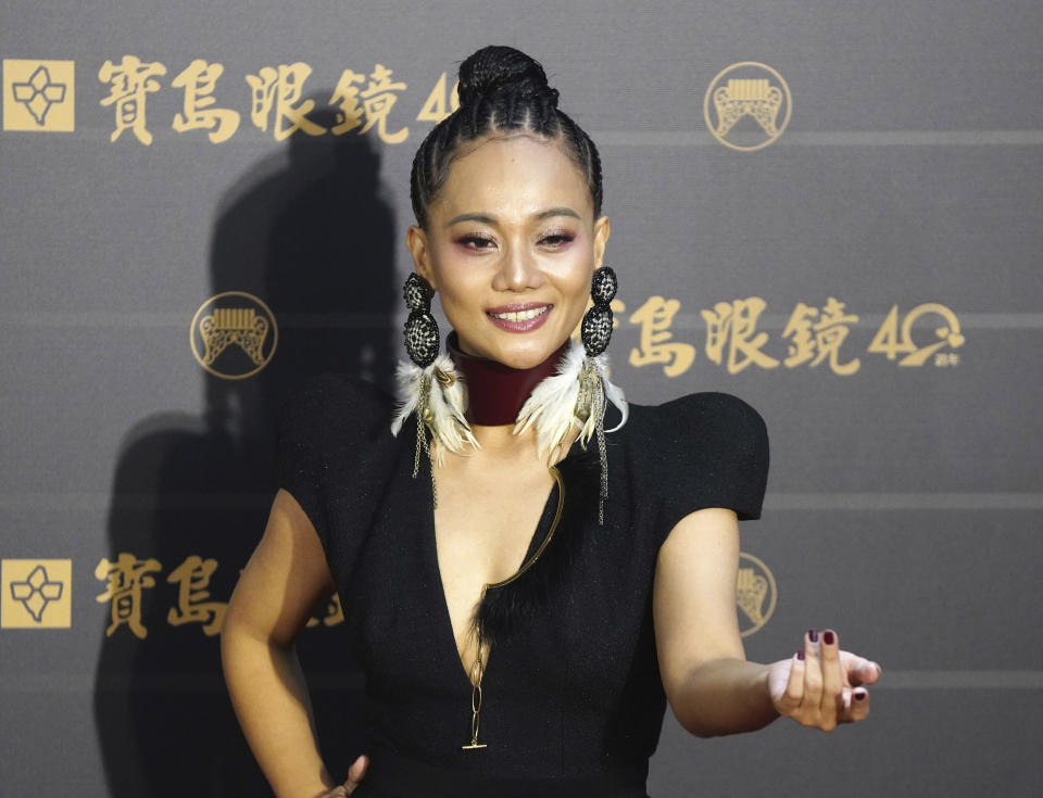 Taiwanese singer Abao poses as she arrives at the 31th Golden Melody Awards in Taipei, Taiwan, Saturday, Oct. 3, 2020. The awards show, one of the world's biggest Chinese-language pop music annual events was postponed from June to Oct. due to the coronavirus pandemic. (AP Photo/Billy Dai)