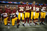 <p>Washington Redskins players during the the national anthem before the game against the Oakland Raiders at FedExField in Landover, Maryland. (Patrick Smith/Getty Images) </p>