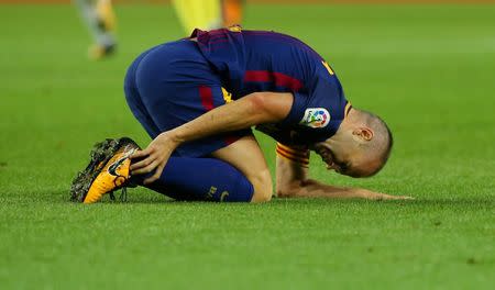 Soccer Football - La Liga Santander - FC Barcelona vs Malaga CF - Camp Nou, Barcelona, Spain - October 21, 2017 Barcelona’s Andres Iniesta after sustaining an injury REUTERS/Albert Gea