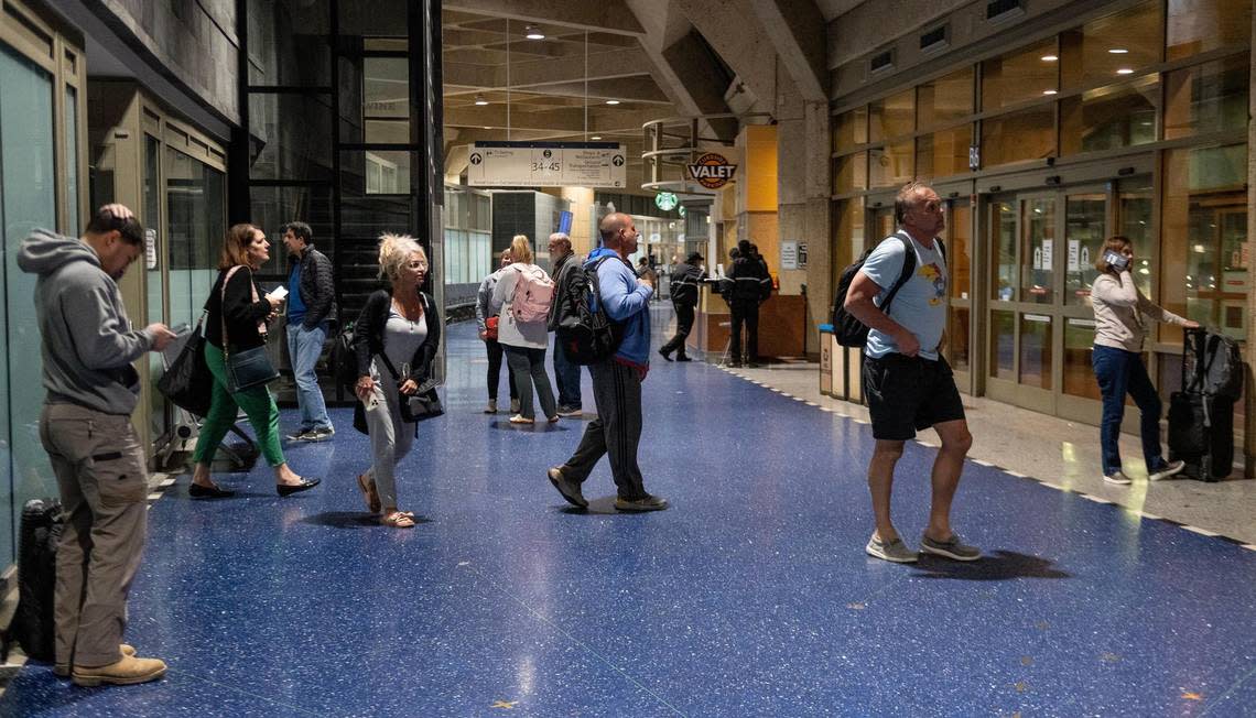 People exit the gate area in terminal B after a Feb. 27 flight on the last day of operations at Kansas City International Airport’s old terminals.