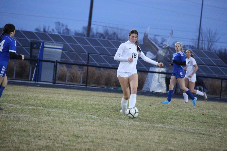 ADM's Tatum Schmitz looks to pass the ball during a game against Perry on Monday, April 3, 2023, at Dewey Field.