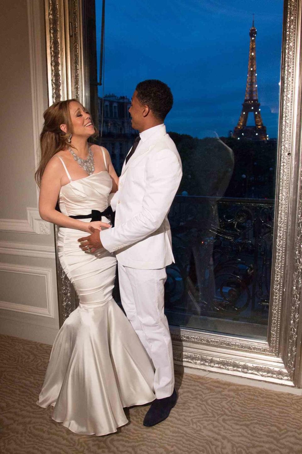 Mariah Carey and her husband Nick Cannon during their wedding vows renewal ceremony, photocall at Maison Blanche on April 27, 2012 in Paris, France