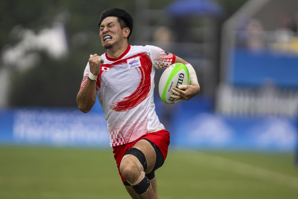 Japan's Fukushi Moeki runs to score a try during the men's semifinal Rugby Sevens match between Hong Kong and Japan at the 19th Asian Games in Hangzhou, China, Tuesday, Sept. 26, 2023. (AP Photo/Louise Delmotte)