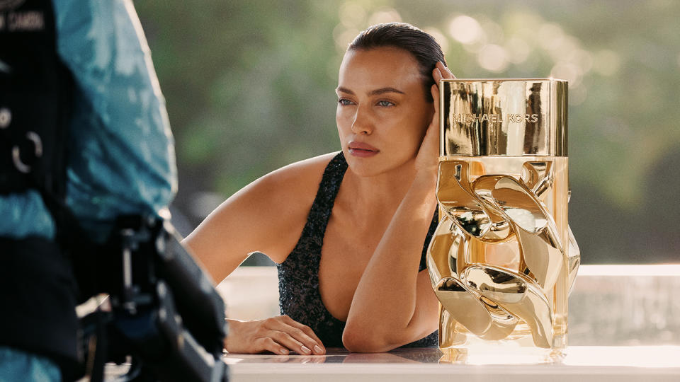 A behind-the-scenes moment of Irina Shayk from the set of the Michael Kors ad campaign.