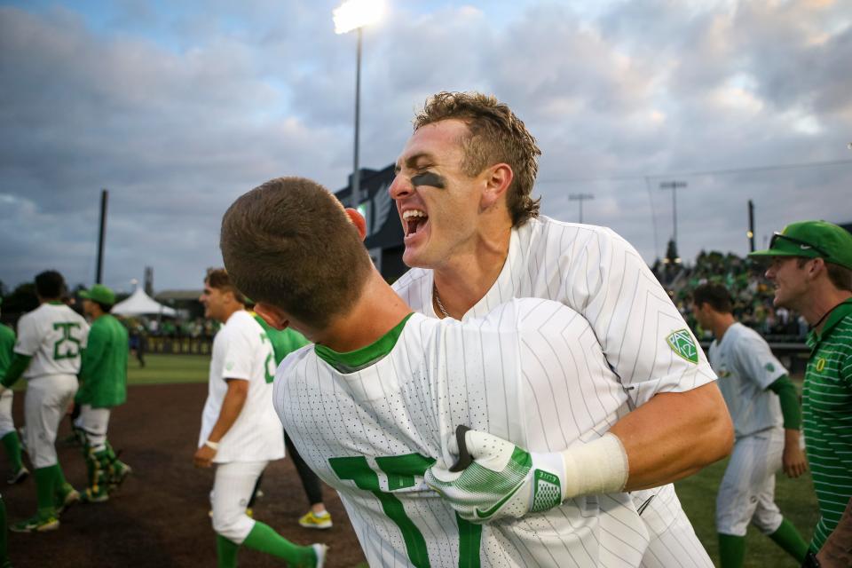 Oregon outfielder Tanner Smith, right and infielder Drew Smith celebrate as the Oregon Ducks defeated Oral Roberts University 9-8 in the first game of a best of three NCAA Super Regional series at PK Park in Eugene, Ore. Friday, June 9, 2023.