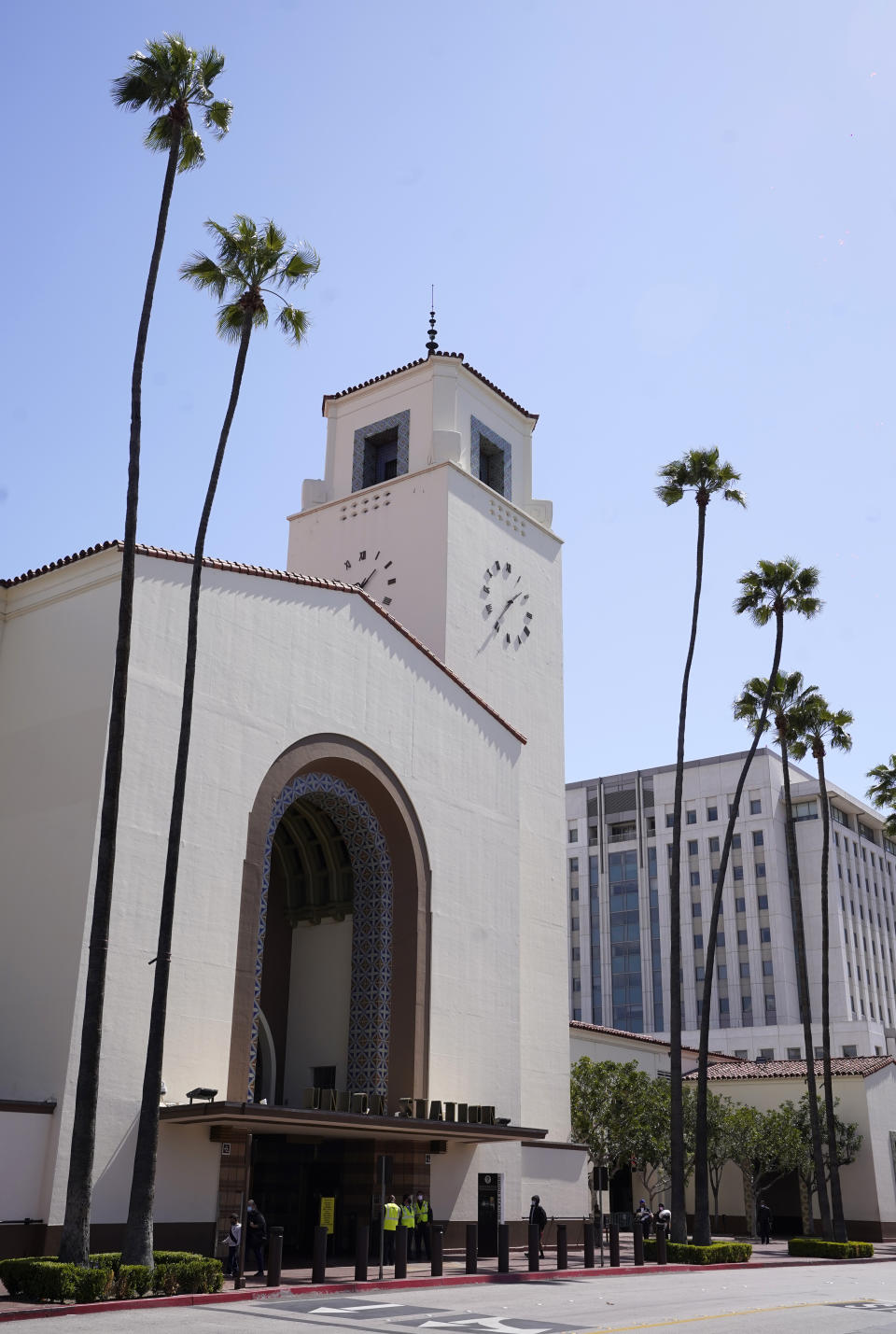 The exterior of Union Station in Los Angeles appears on March 23, 2021. The Oscars are headed to the historic site for the first time this year. With wide open spaces and 65-foot high ceilings, it’s ideal for a big crew and cameras. It’s been used in car commercials, reality shows and procedurals. But its beamed ceilings, Spanish tile floors and regal bronze chandeliers really shine in cinema where it’s played train stations, banks, police stations, clubs and airports. (AP Photo/Chris Pizzello)