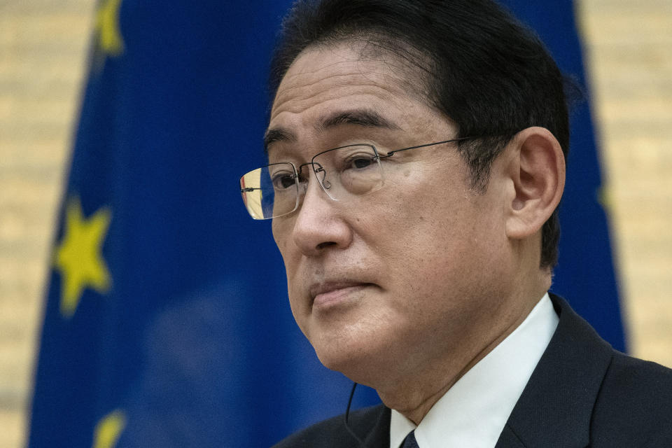 Japanese Prime Minister Fumio Kishida listens as he takes part in a joint press conference with Greek Prime Minister Kyriakos Mitsotakis following their meeting at the prime minister's official residence in Tokyo, Monday, Jan. 30, 2023. (Richard A. Brooks/Pool Photo via AP)