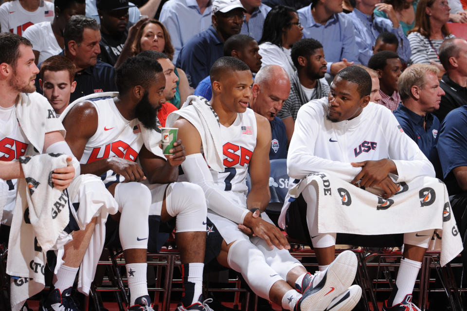 James Harden #12, Russell Westbrook #7 and Kevin Durant #5 of the US Men's Senior National Team talks on the bench against the Dominican Republic during an exhibition game at the Thomas and Mack Center on July 12, 2012 in Las Vegas, Nevada. (Andrew D. Bernstein/NBAE via Getty Images)